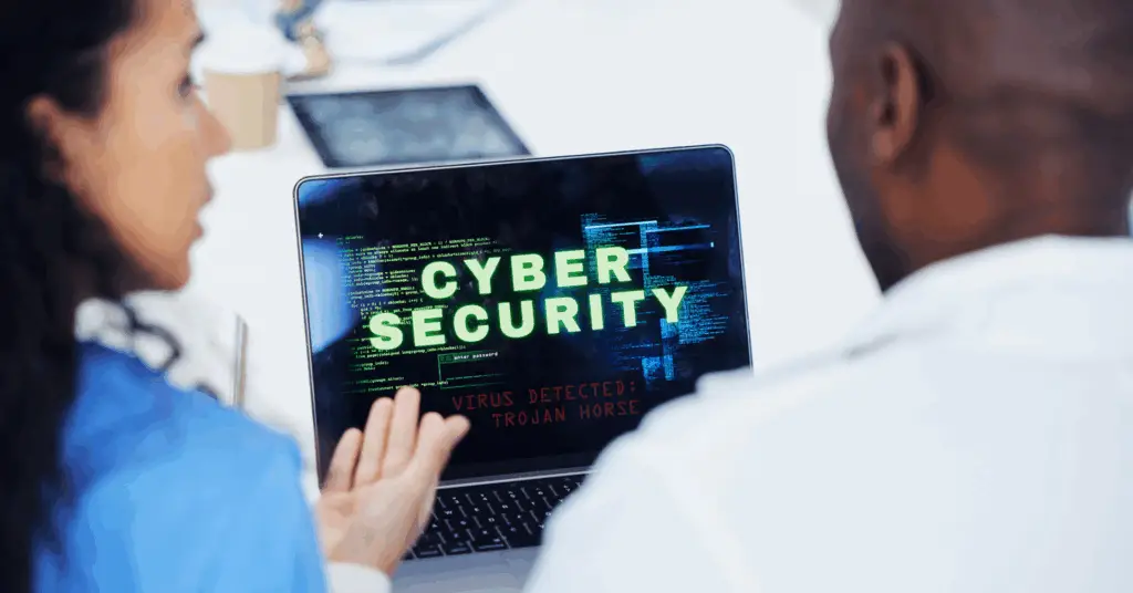 2025.05-two physicians looking at a computer screen discussing cyber security-blog header