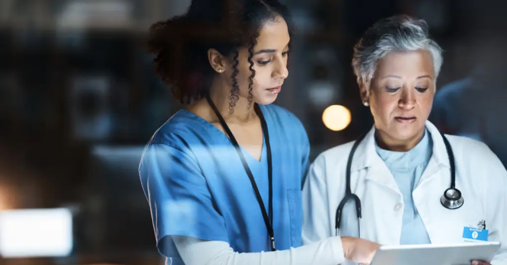 physician and nurse talking