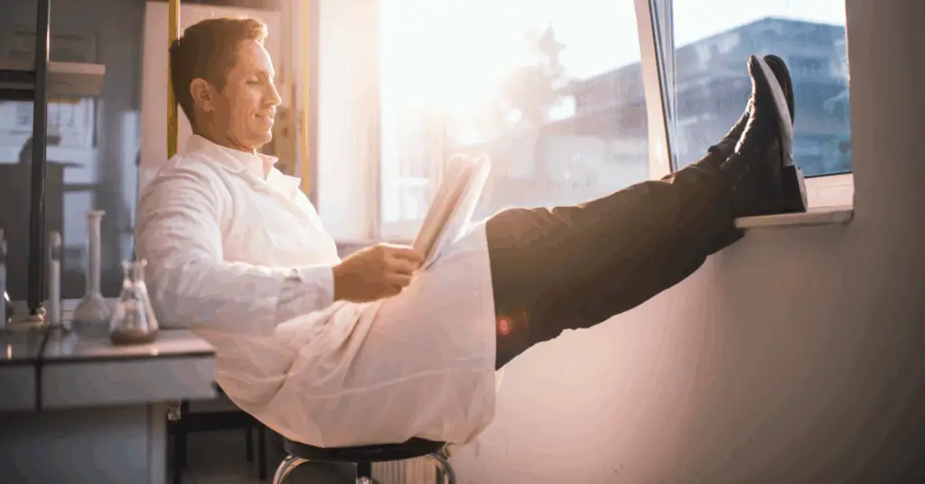 physician relaxing and reading in a hospital setting