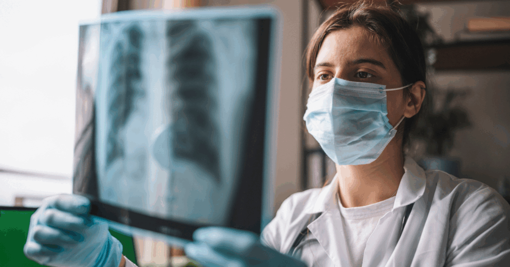 Medical Worker Analyzing X-Ray Picture Of Lungs