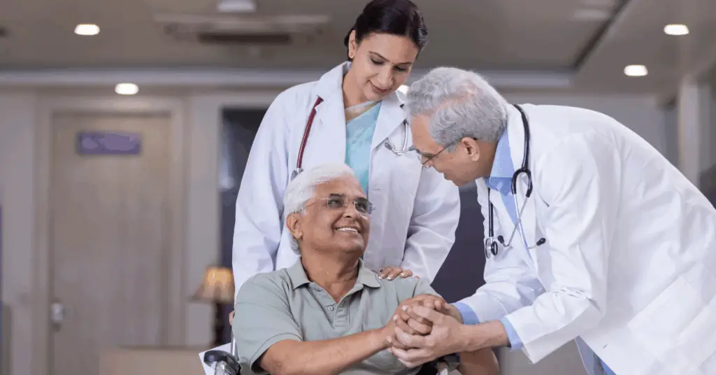 doctor smiling and talking to patient in wheelchair