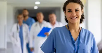 resident physician smiling at camera
