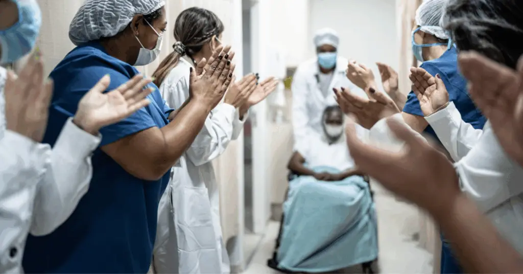 covid patient celebrating with hospital
