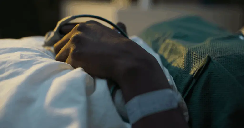 covid patient in hospital bed