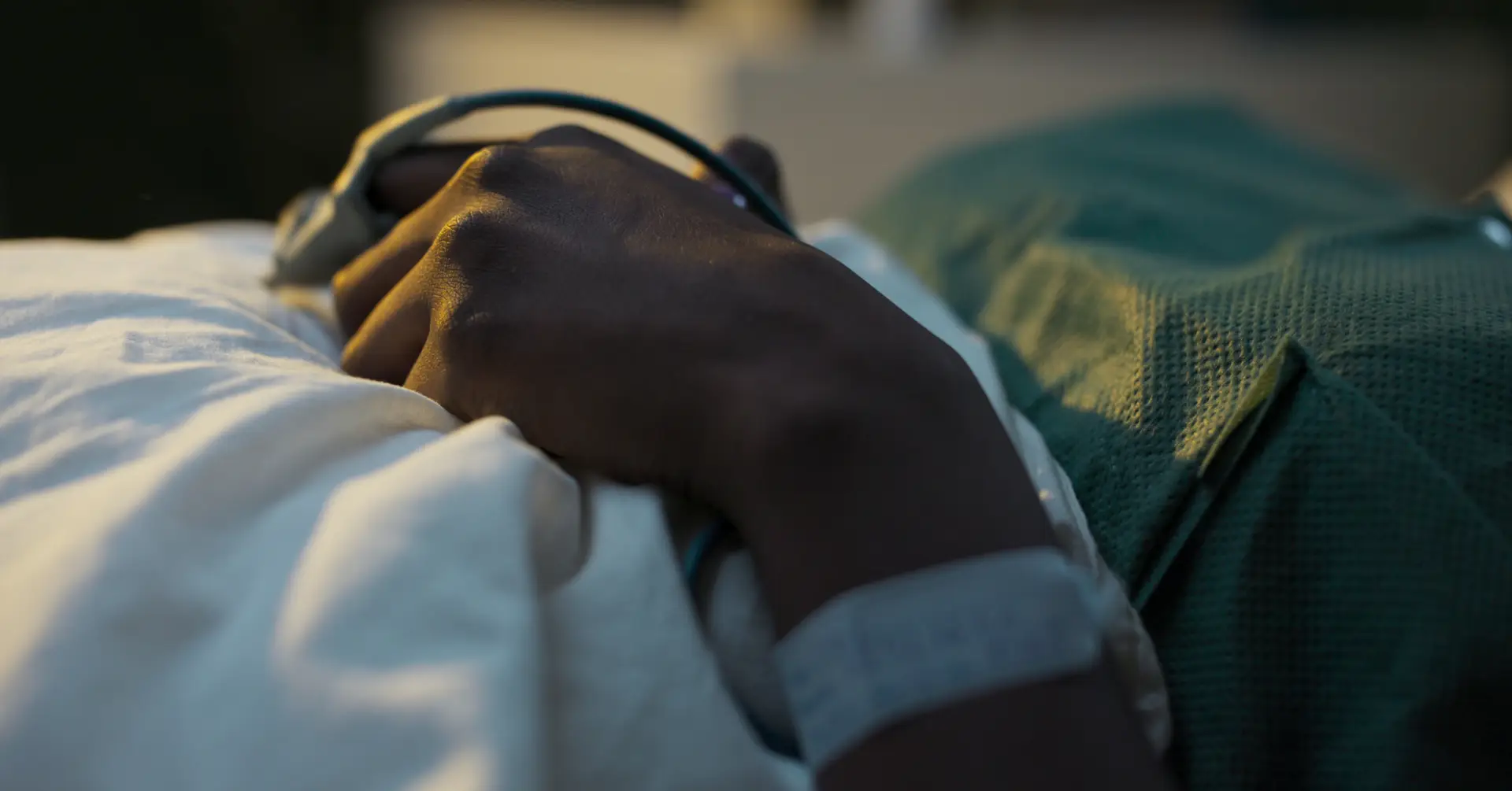 covid patient in hospital bed