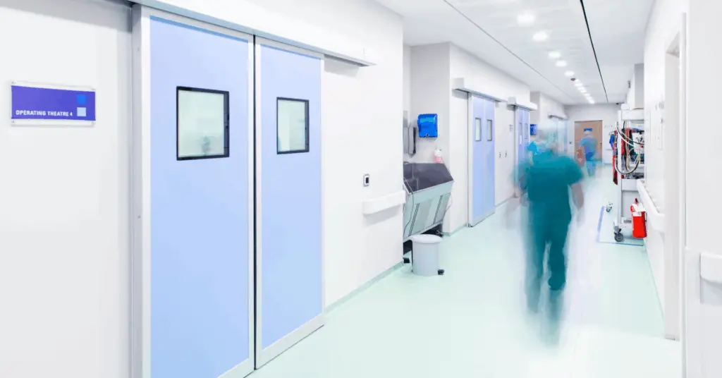 doctor rushing around ER halls in hospital