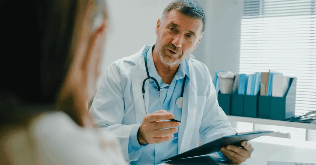doctor speaking to a patient in exam room