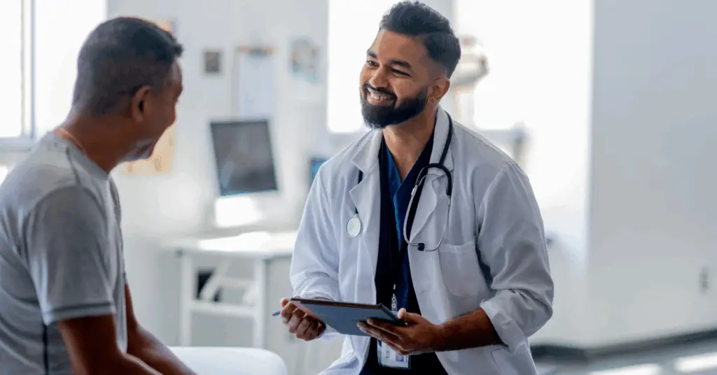 doctor speaking to patient smiling
