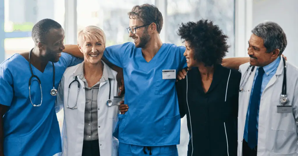 medical doctors smile and laugh with one another