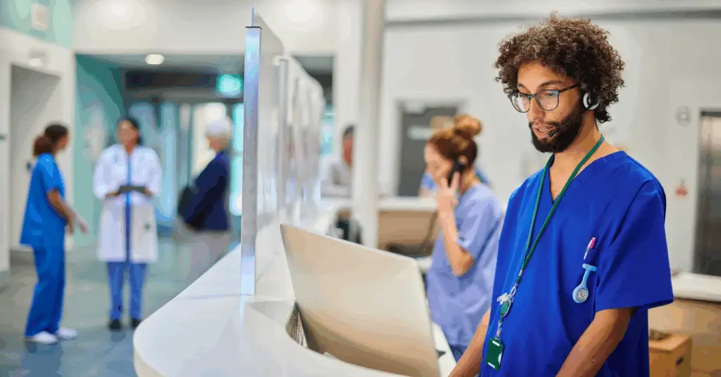 medical professional at a computer in a hospital
