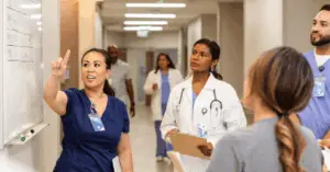 medical professional discusses plan using whiteboard