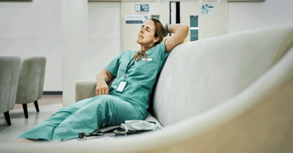 medical professional lying on couch with eyes closed