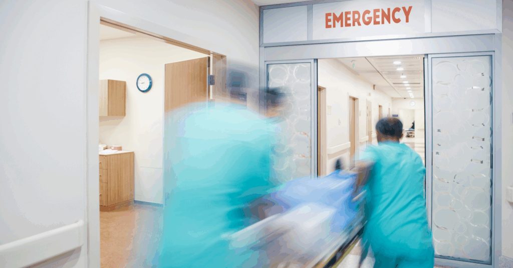 medics pushing patient in er