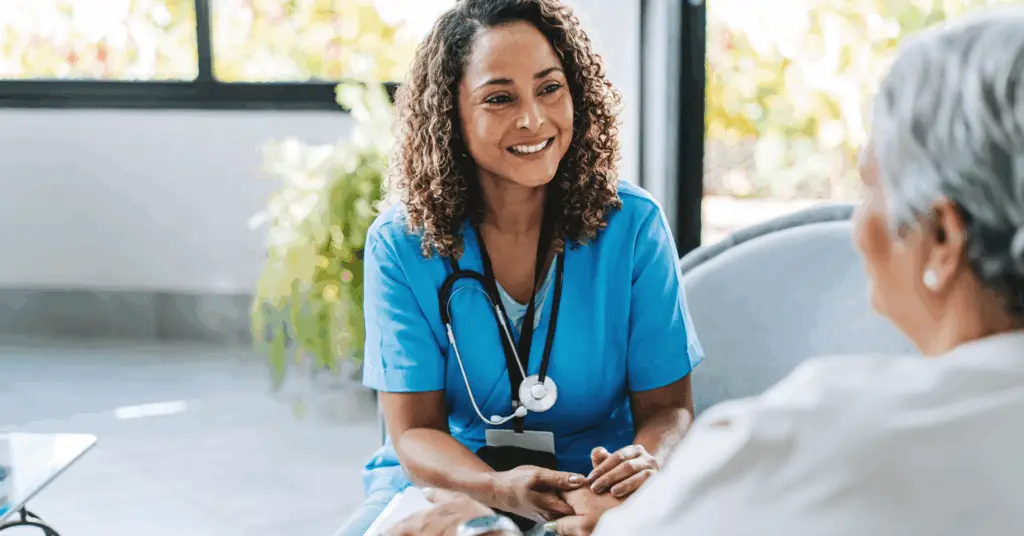 nurse holding a patient hand in hospital