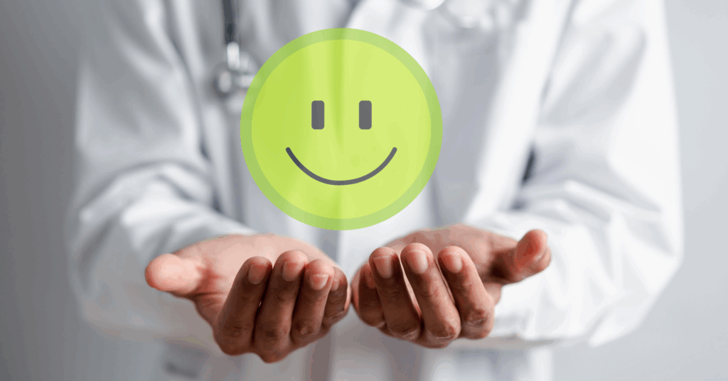 physician hands holding a smiling face
