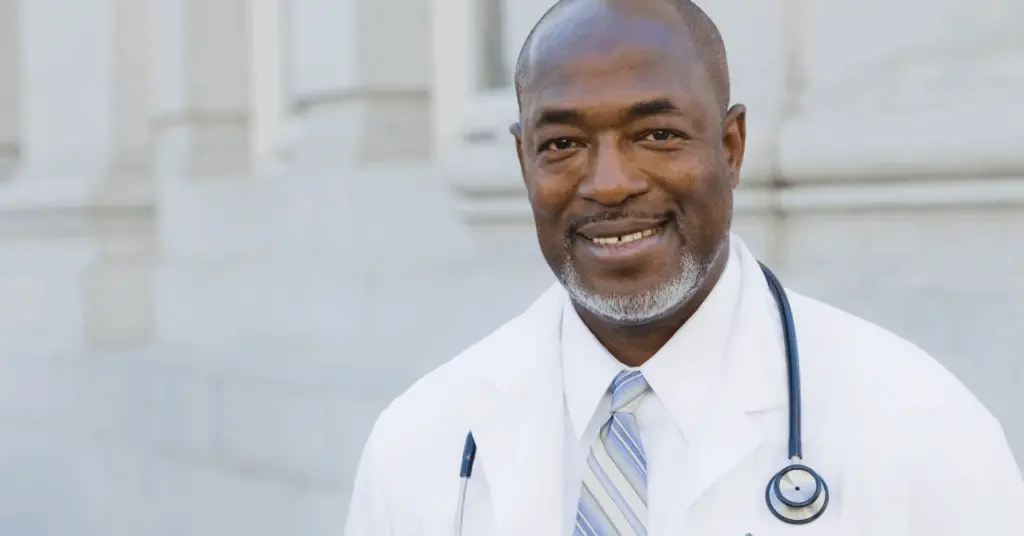 physician smiling at camera