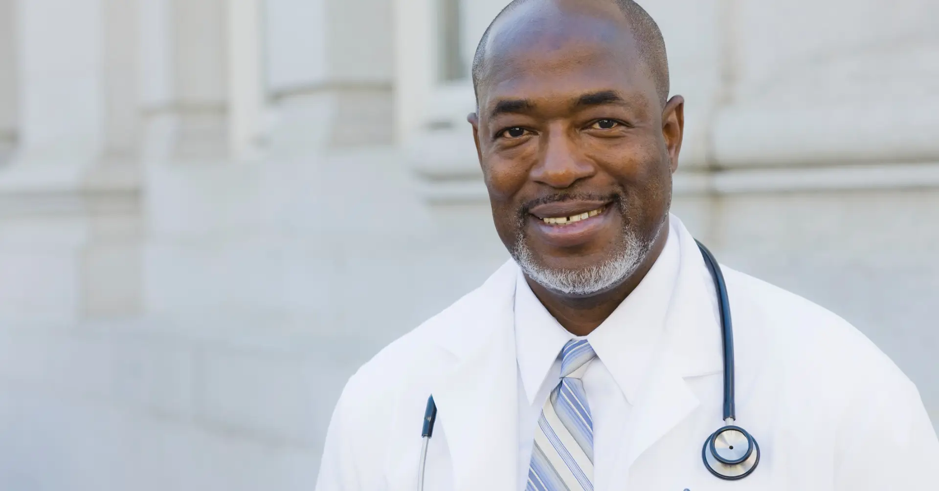 physician smiling at camera