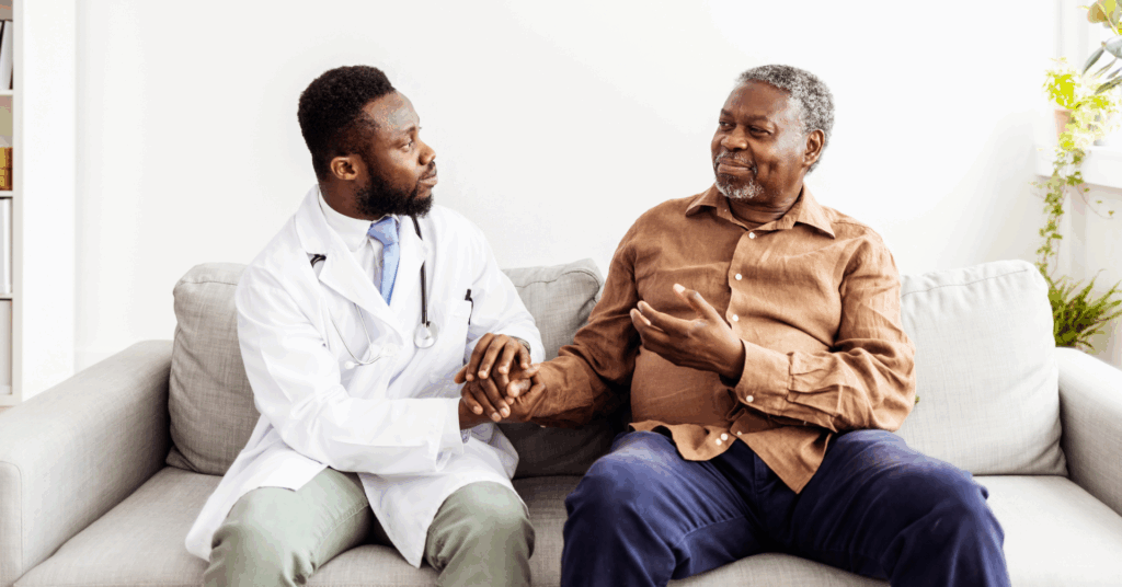Friendly general practitioner communicating with pleasant 80s male patient