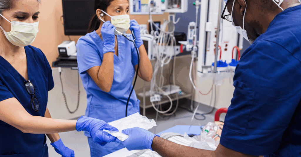 doctors working on a patient in the emergency room