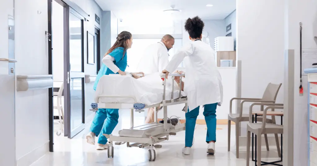 nurses and doctors running through ER with patient