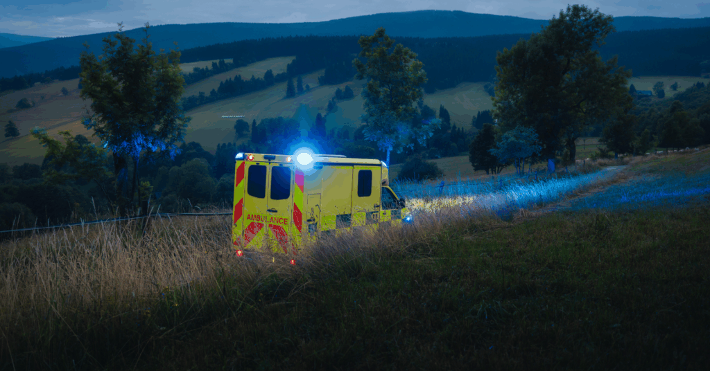 ambulance bus driving through rural countryside