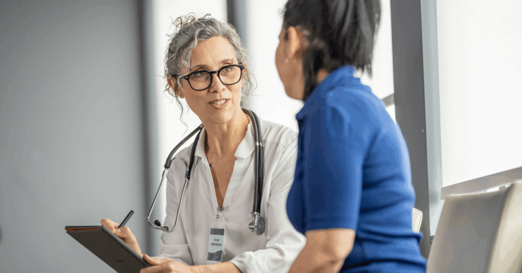 doctor consulting with patient in hospital