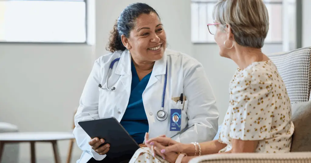 doctor smiling at patient during exam
