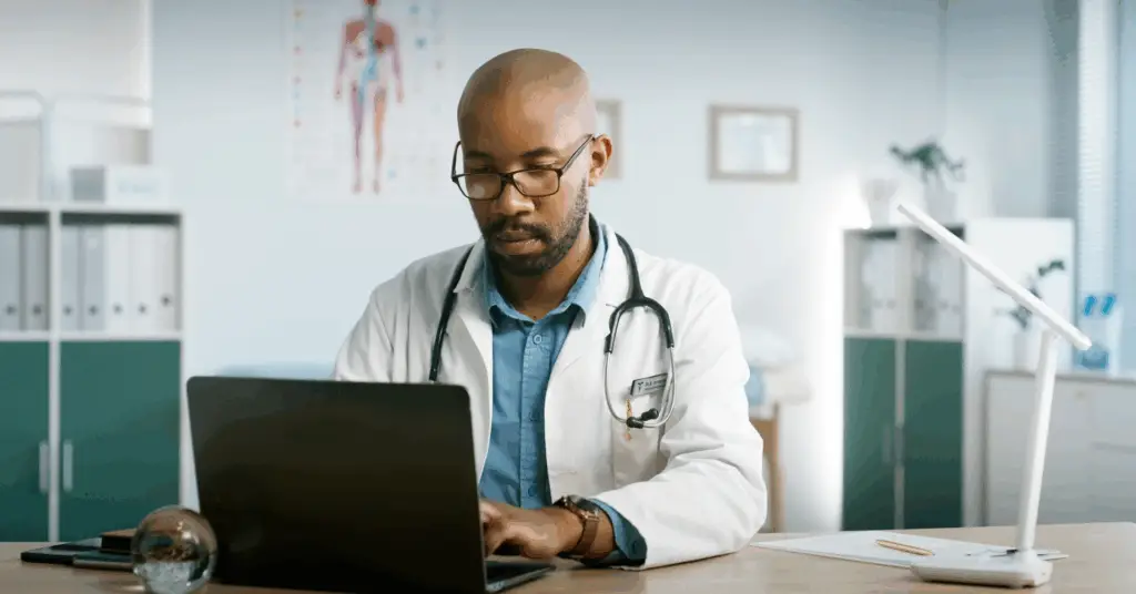 doctor speaking to patient via computer