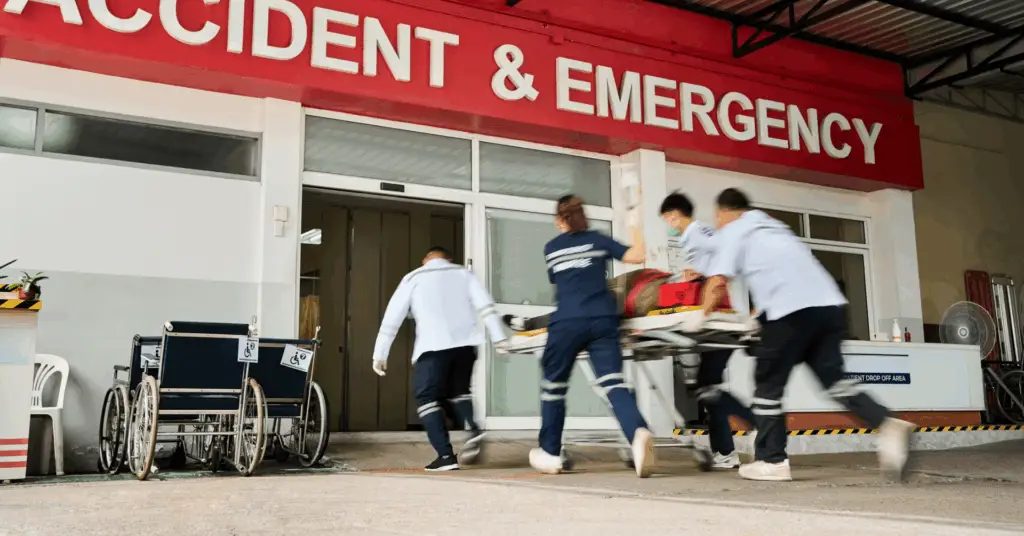 emergency personnel rushing patient into the er