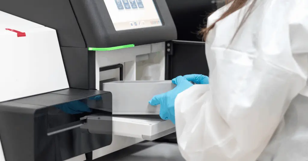 scientist handling samples in a lab