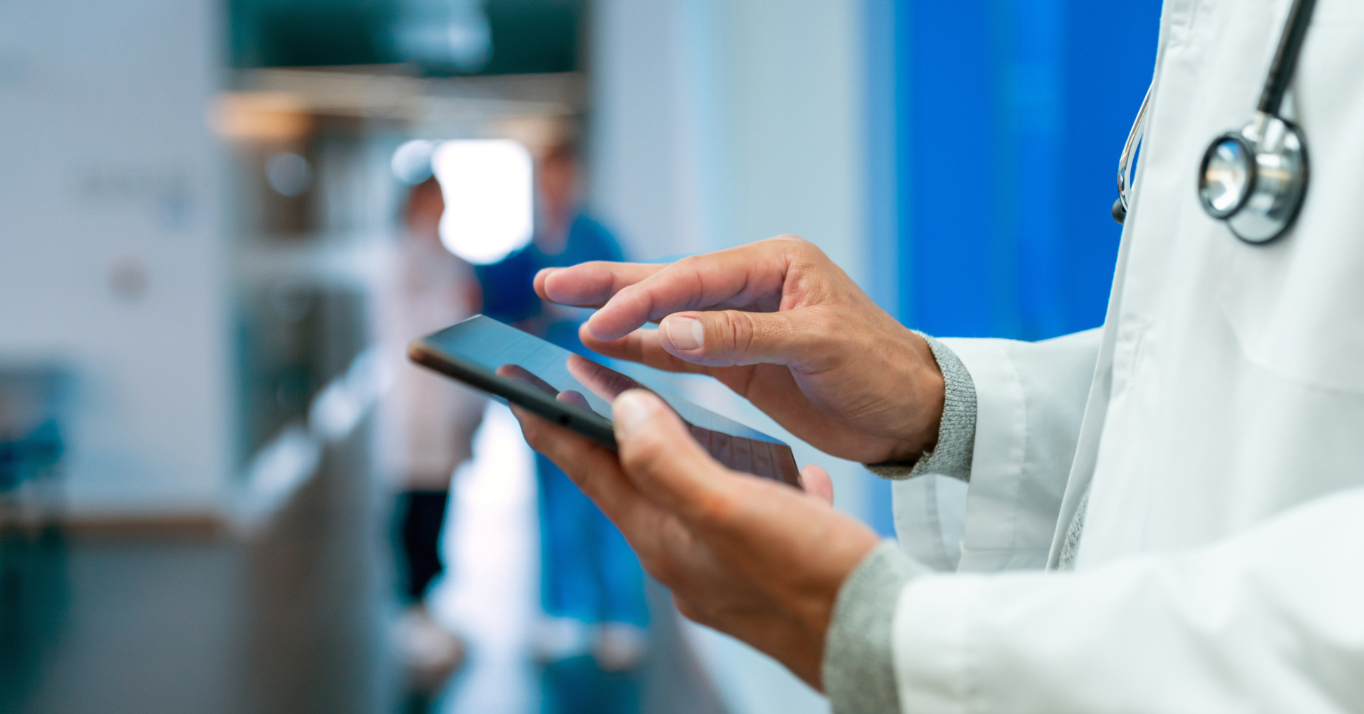 doctor working on smart tablet
