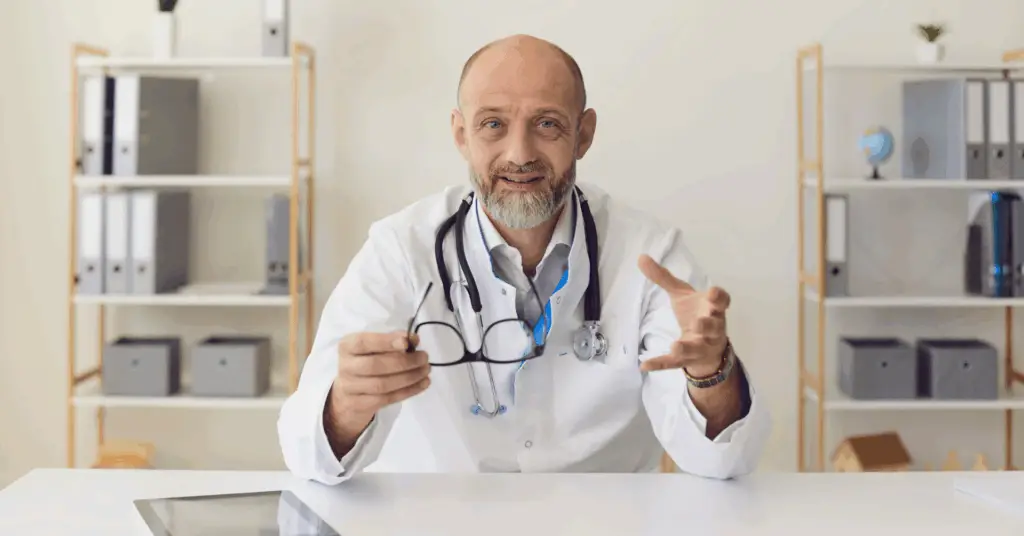 doctor speaking into the camera in a room