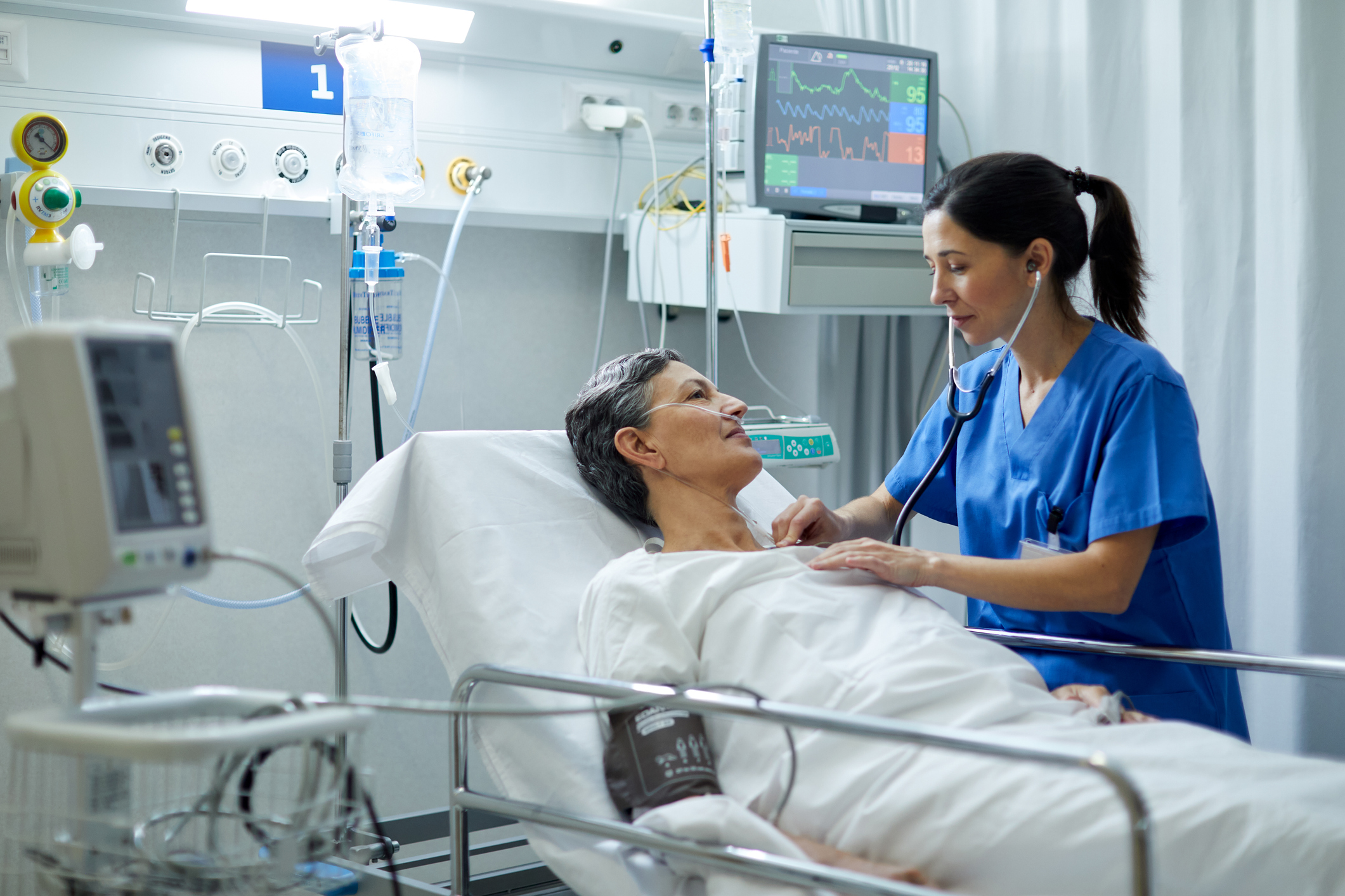 Medical professional using a Stethoscope on a patient.