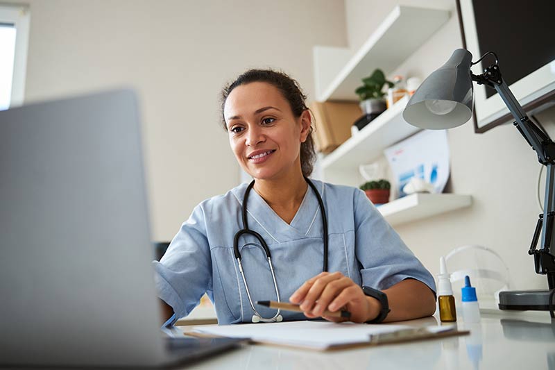 Intensivist conducting a Telehealth appointment with a patient.