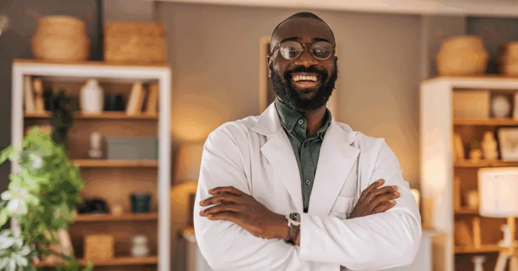 black doctor looking at camera smiling