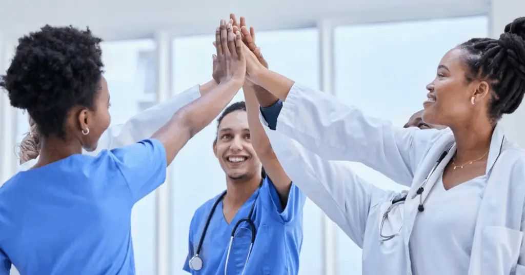 medical professionals celebrating with each other