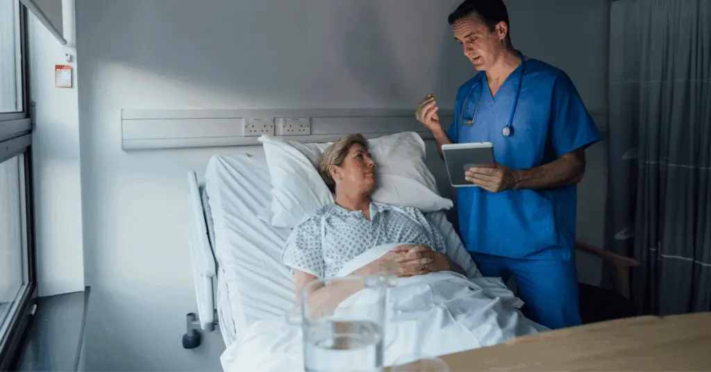 doctor talking to patient in hospital bed