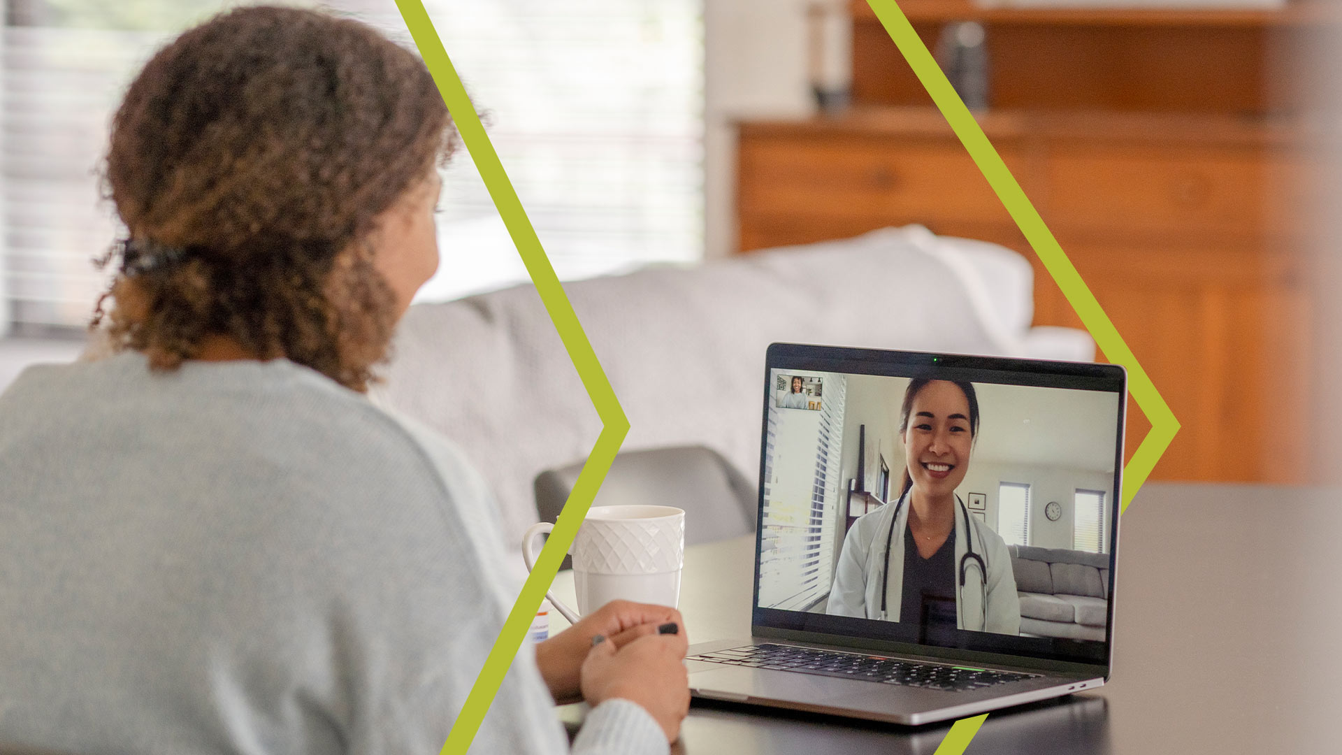 Physician leading a virtual health appointment with patient through a laptop.