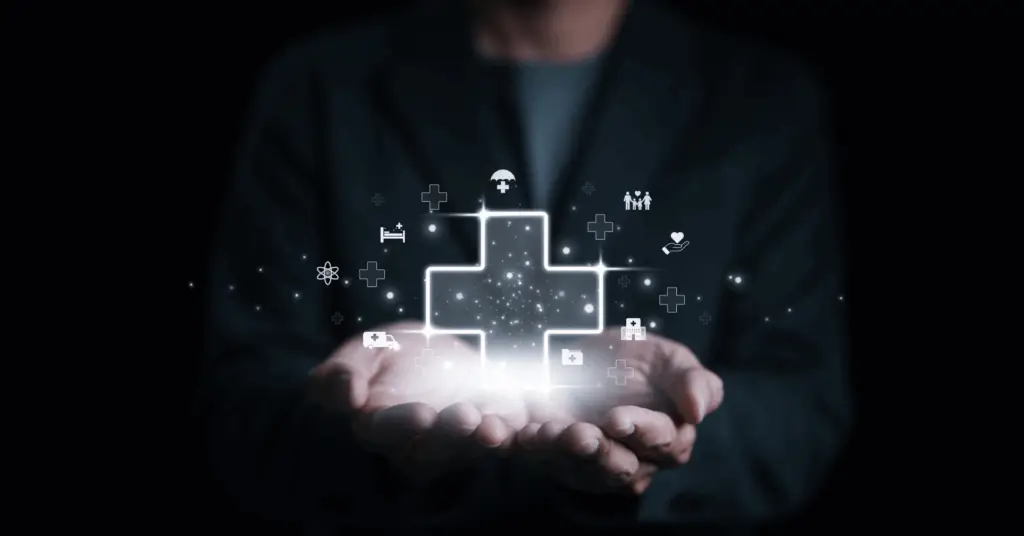medical icons hovering over open hands