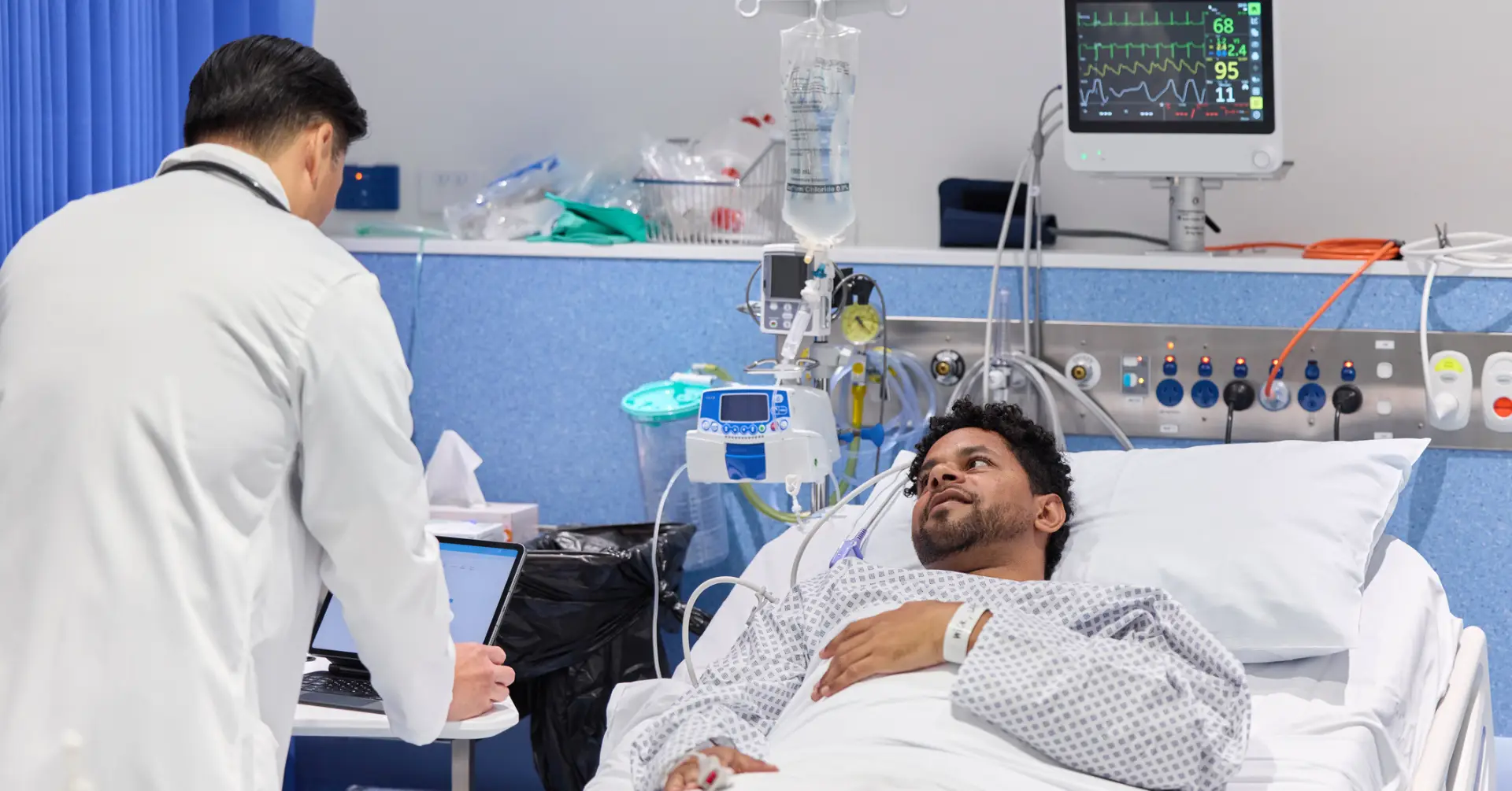 two doctors working on a patient in the er