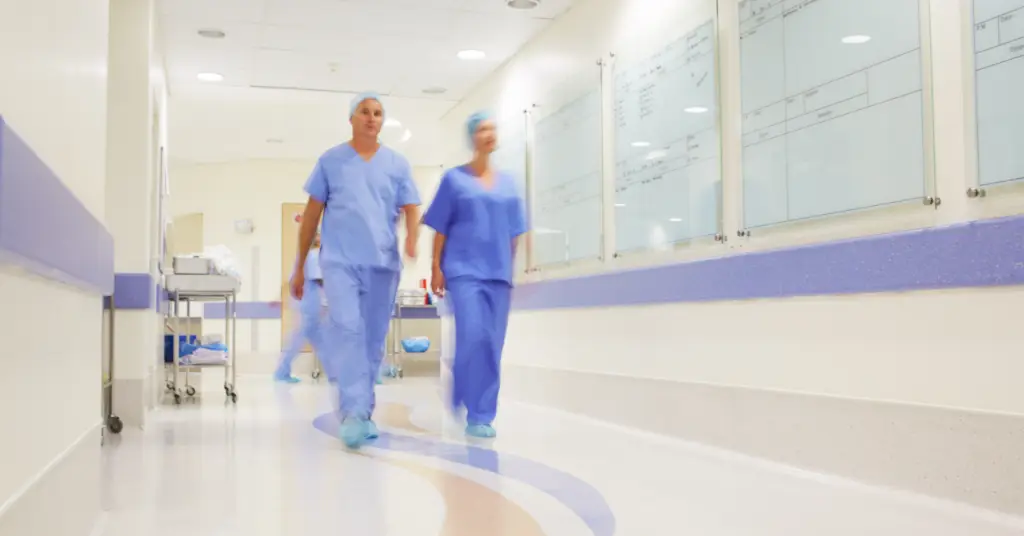 physicians walking down a hospital hall