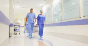 physicians walking down a hospital hall