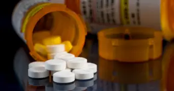 bottle of pills spilled over
