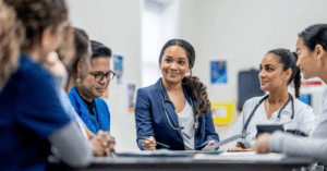 medical professionals discussing patient care during a meeting in a hospital board room