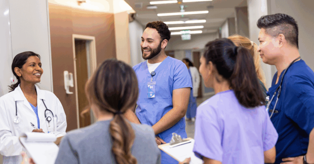 group of medical professionals discussing around a job board