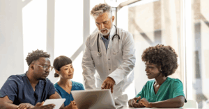 medical director speaking to a group of medical professionals