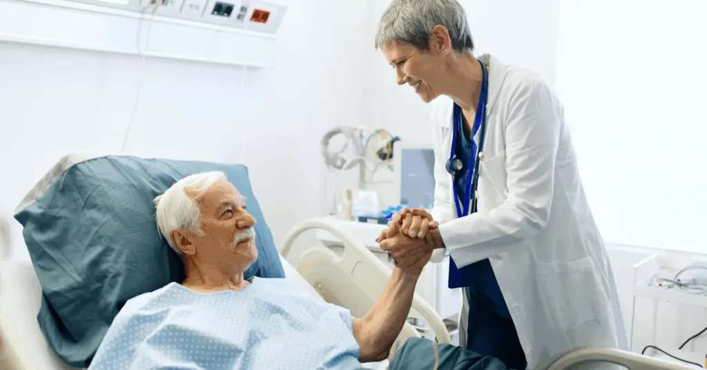 doctor talking to patient in hospital bed