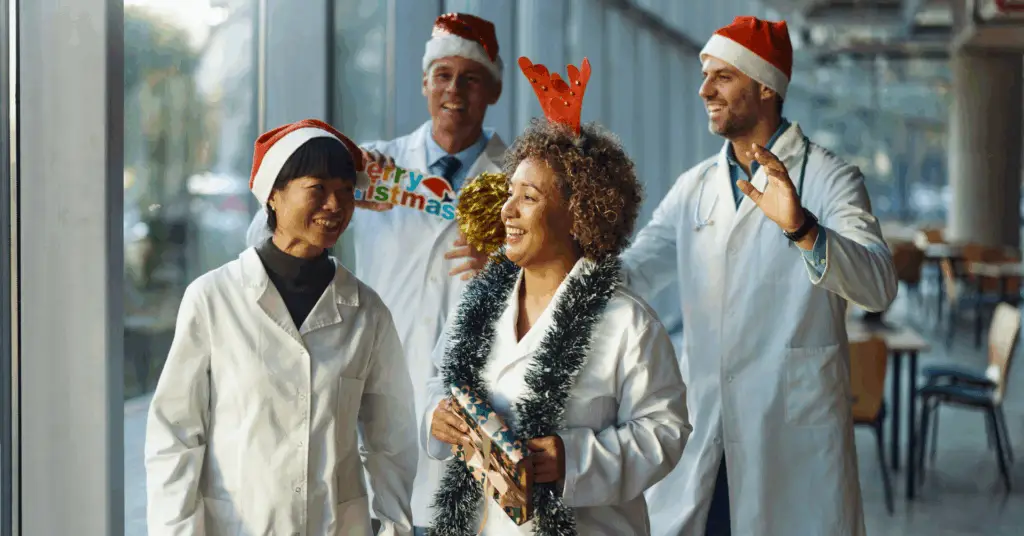 group of doctors celebrating the holidays in festive attire