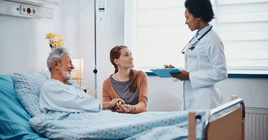 doctor speaking to patient and family in hospital room