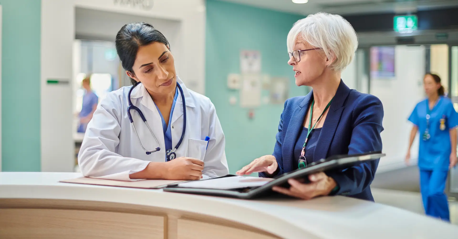 executive talking to doctor at hospital